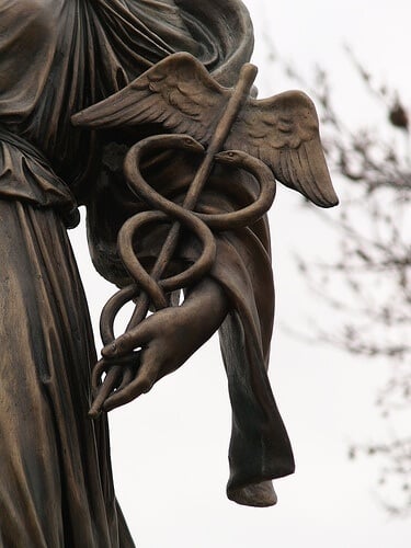 Detail of Bronze Sculpture Holding Medical Symbol, Caduceus 